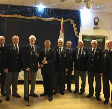 Rayleigh and Wickford MP Mark Francois presenting the Legion d’Honneur to Second World War veteran Mr Alan Iles in front of his fellow ship mates from the Rayleigh Royal Naval Association.