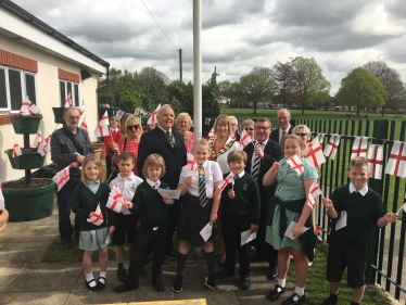 Rayleigh and Wickford MP Mark Francois pictured with Rayleigh Town Council Chairman Councillor Carol Pavelin and pupils from Glebe Primary and Fitzwimarc Schools at the raising of the St George’s Flag Ceremony.