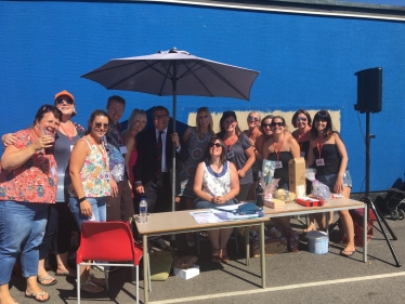 Rayleigh and Wickford MP Mark Francois pictured with Mrs Wass the headteacher of Holt Farm Junior School and members of the Parent Teacher Association at their very successful school summer fete.