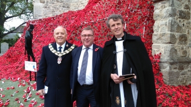 Rayleigh and Wickford MP Mark Francois alongside Councillor Jack Lawmon and Reverend David Oxtoby at a special ceremony to mark the installation of the World War One poppy waterfall at Holy Trinity Church, Rayleigh.